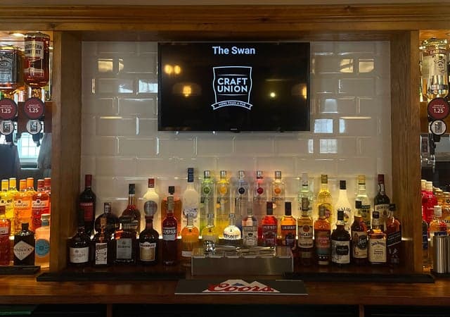 Swan behind the bar