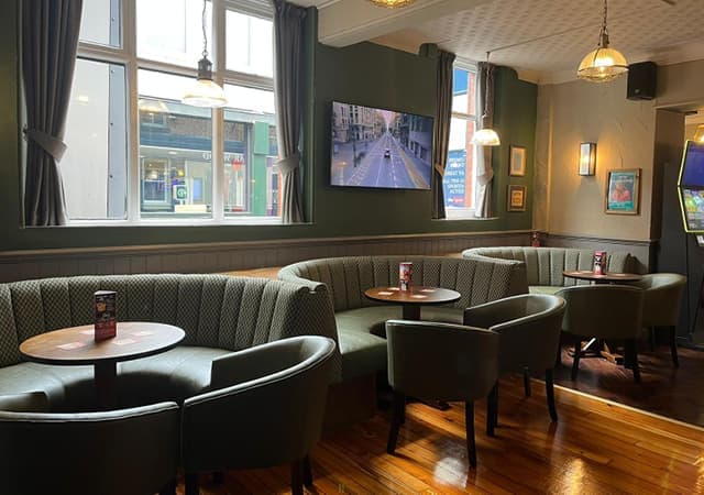 more seating with circular booths and comfy chairs