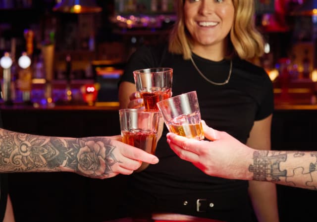 Group toasting shot drinks