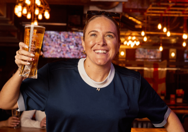 Girl holding a pint