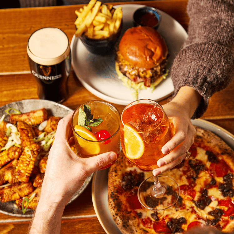 Mix of food and drinks on table