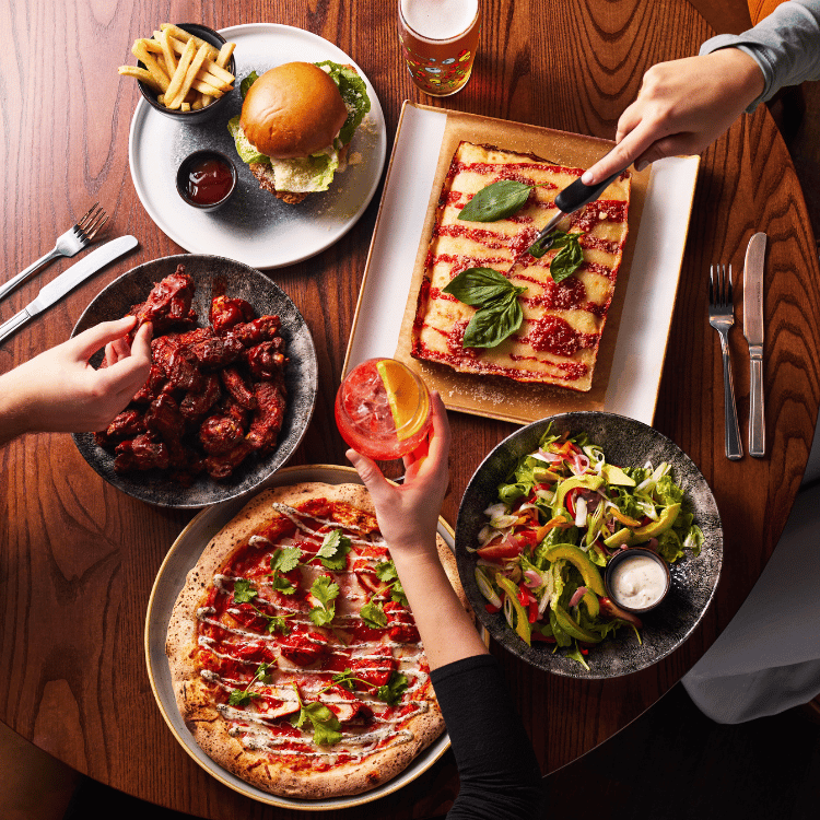 Selection of food dishes on table