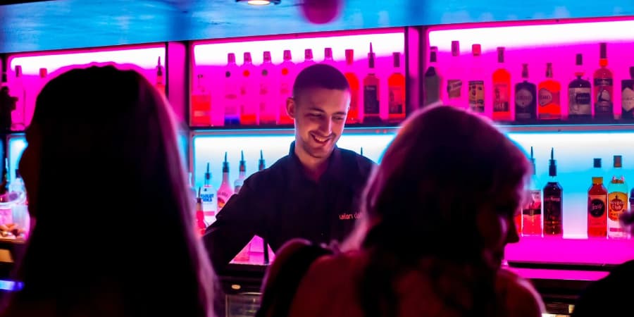Barman serving customers