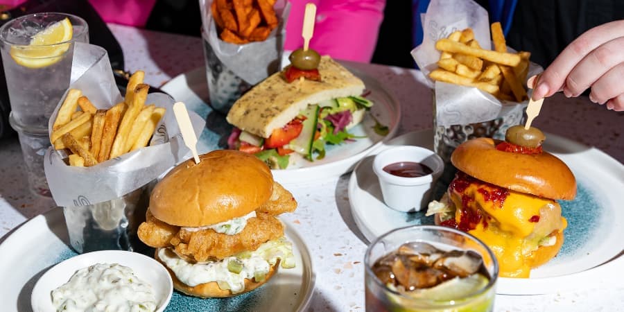Burgers and sandwiches with drinks