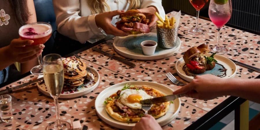 Girls toasting to their brunch in your local area