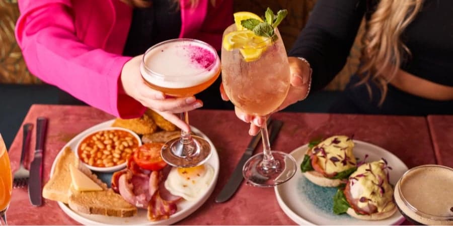 Girls toasting to their bottomless brunch in your local area