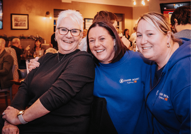 Guests smiling in a pub