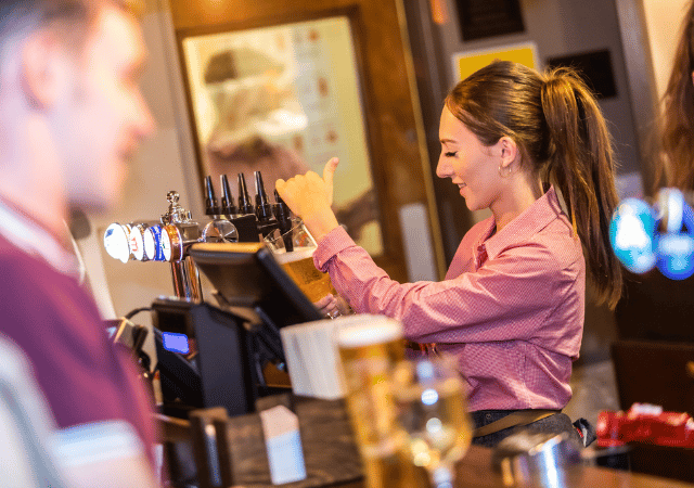 Bar tender pouring a drink