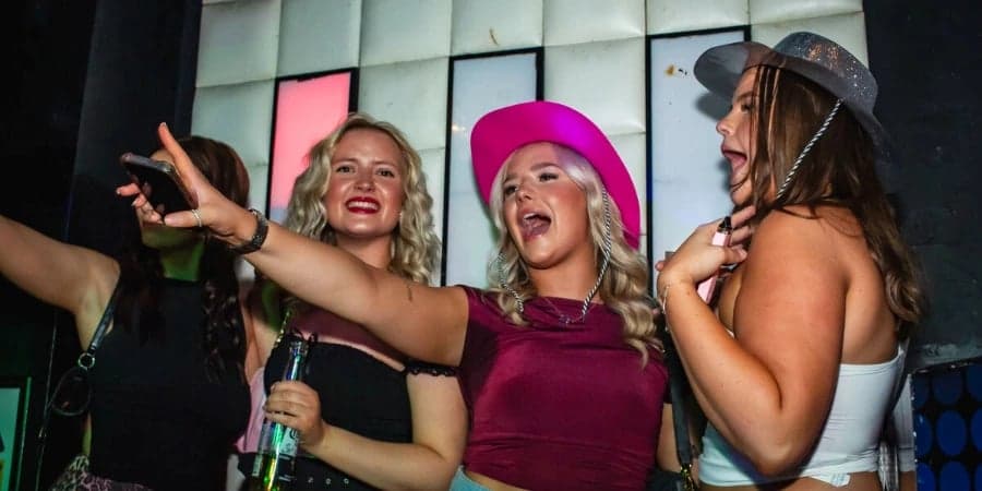People on the stage at Retro Bars