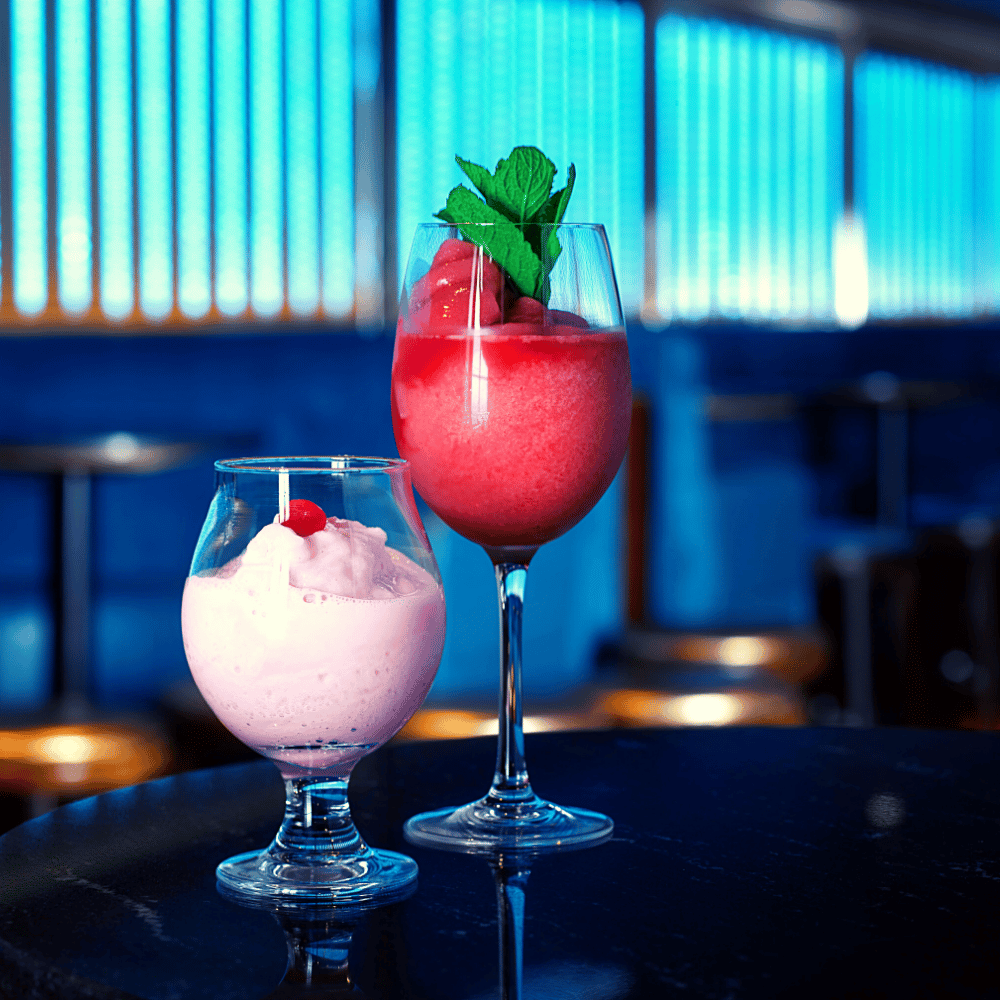 2 Cocktails on Blue Background