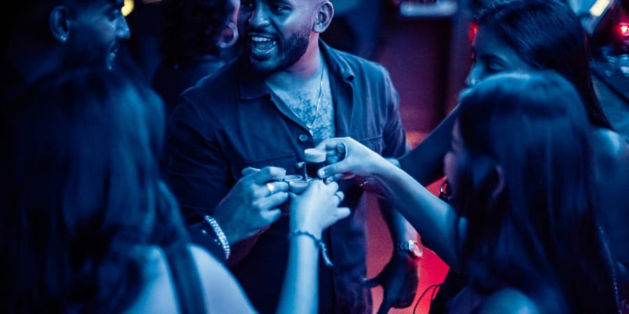 Group of people clinking their drinks