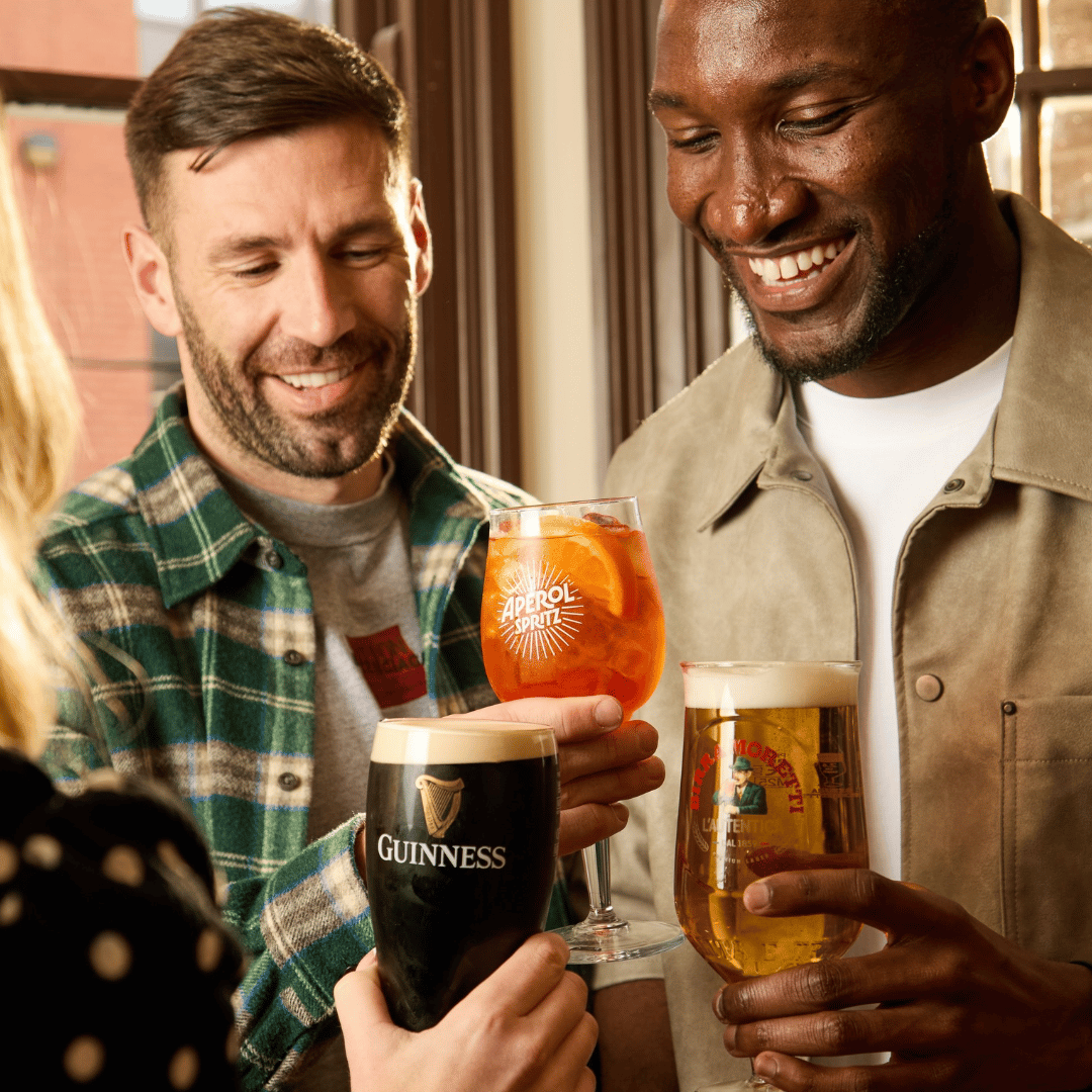 3 people cheersing drinks