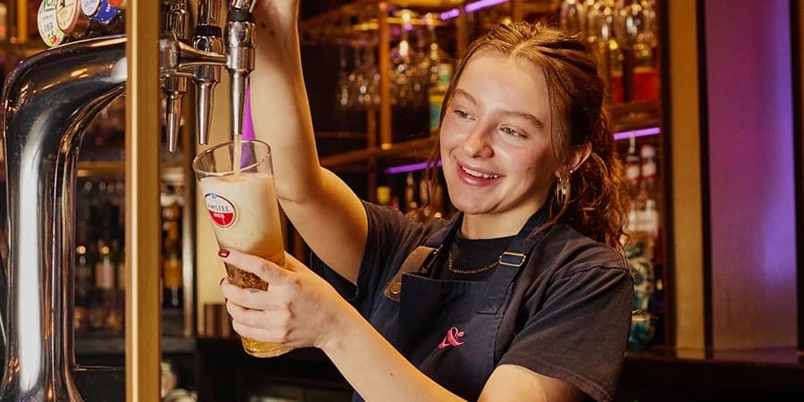 Bar team member looking at the camera.