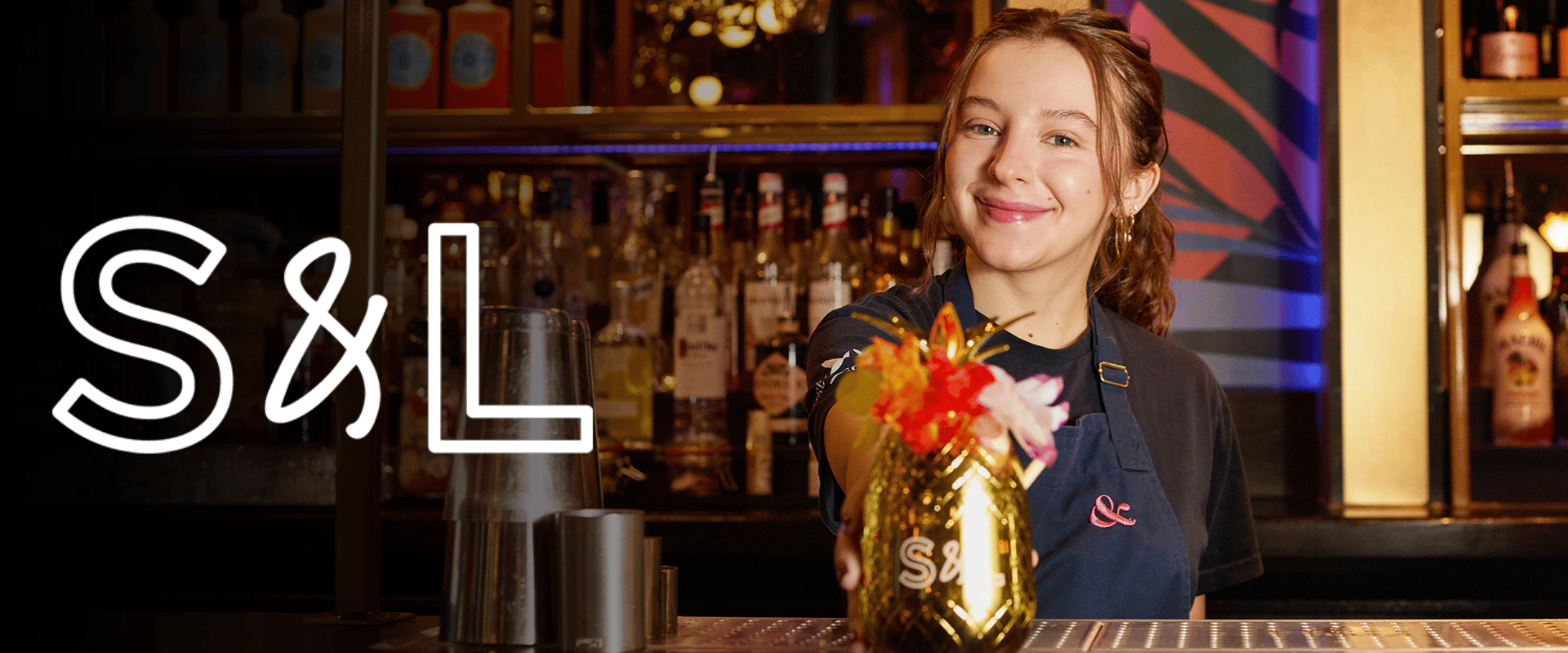 Slug & Lettuce team member behind the bar