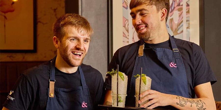 Two team members laughing