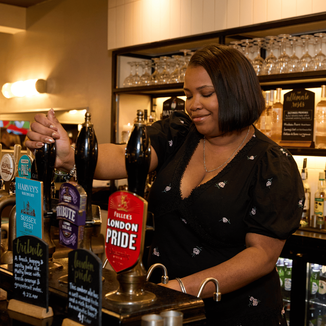 Deputy Manager pouring a pint