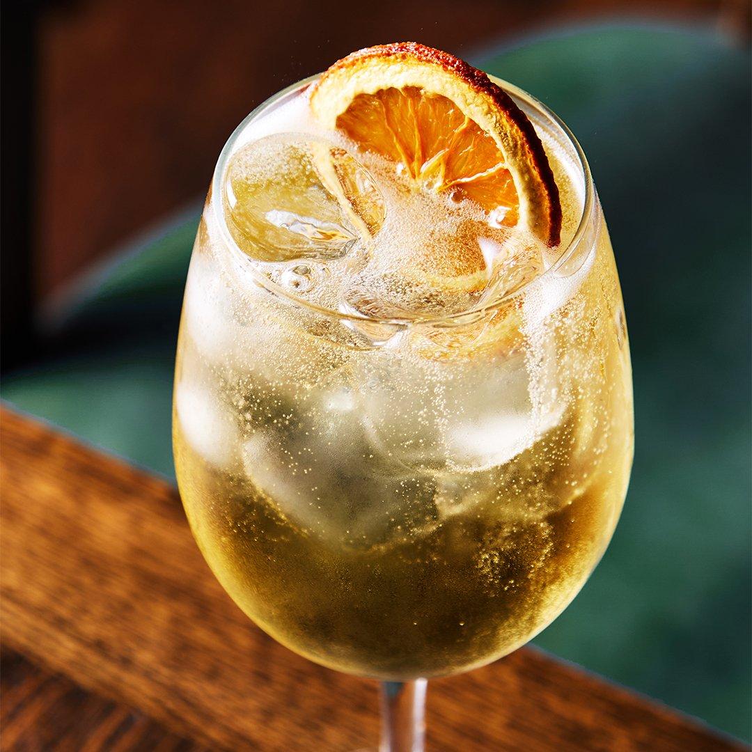 Spritz cocktail with orange wheel