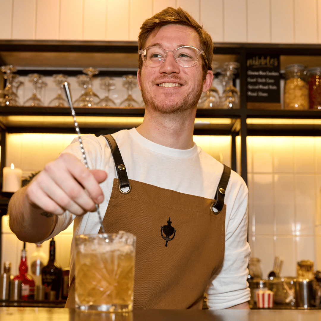 Chapter Collection bartender mixing a cocktail