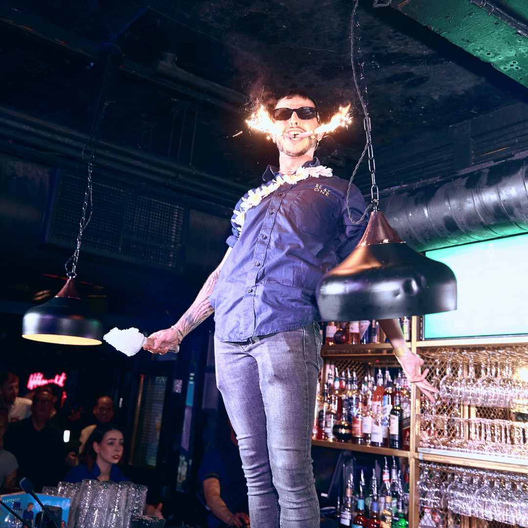 Be At One bartender stood on the bar