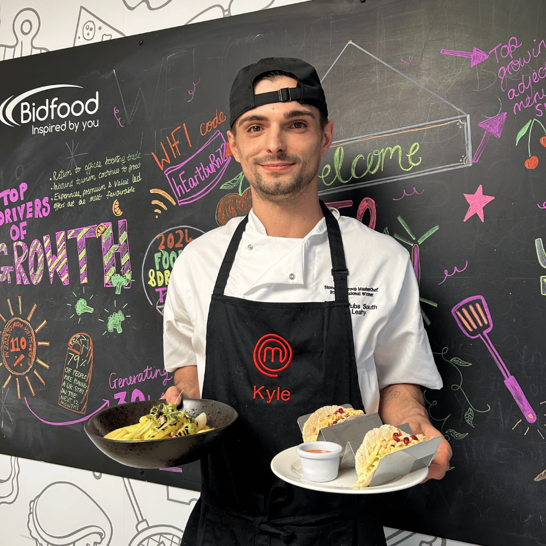 Masterchef finalist, Kyle holding his two final dishes