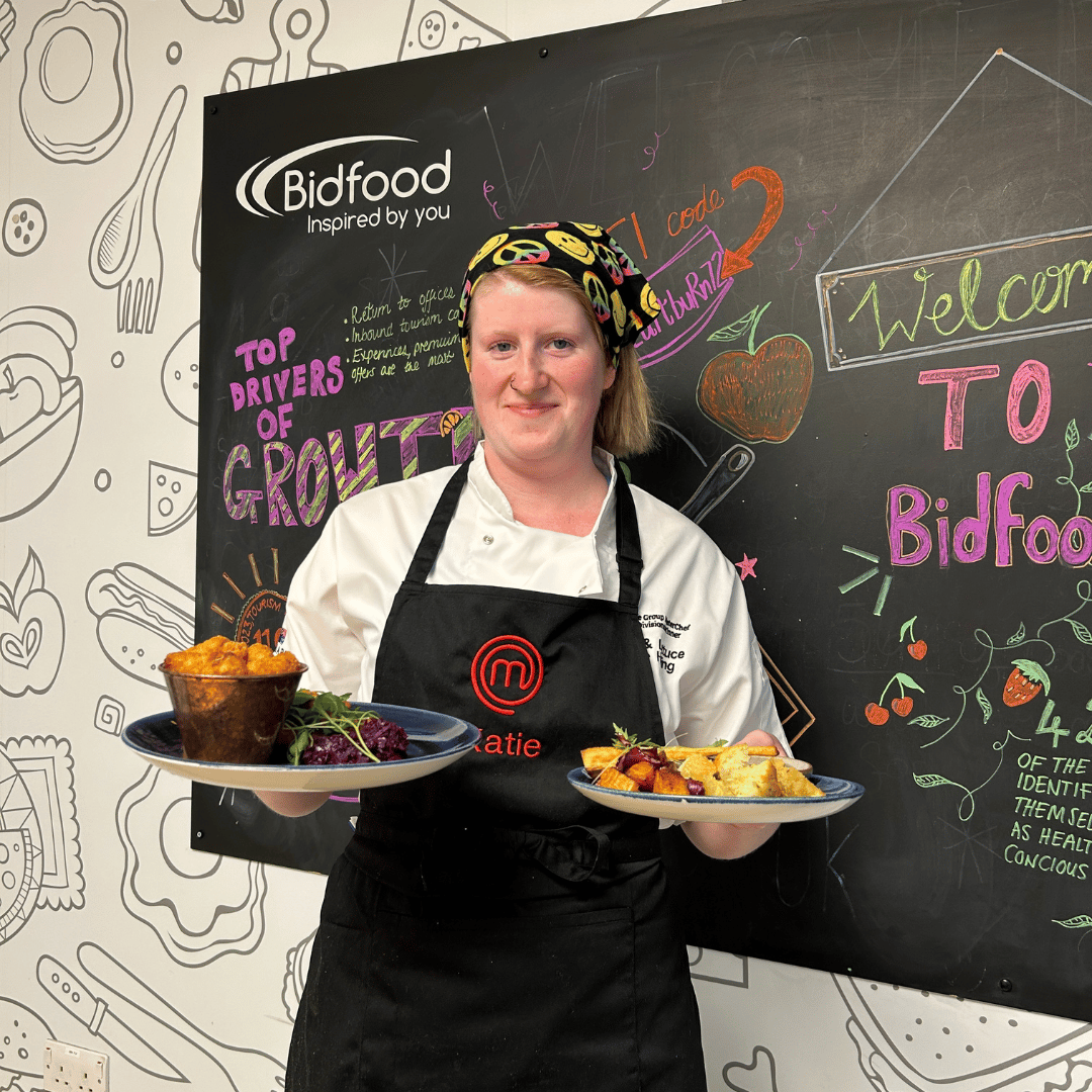 Masterchef finalist, Katie holding his two final dishes