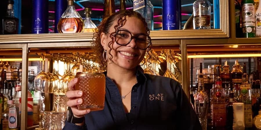 3rd place winner, Isabella posing with their cocktail.