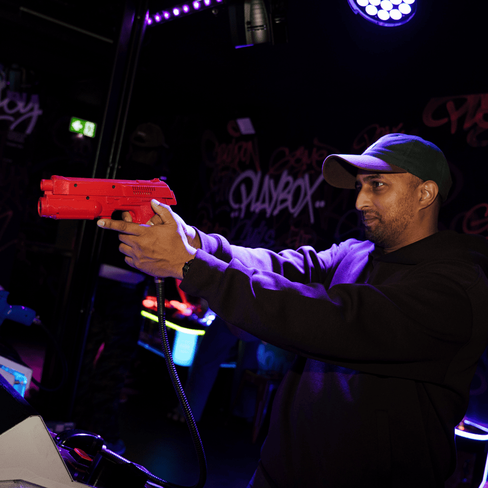 Customer playing Time Crisis at PLAYBOX in Croydon