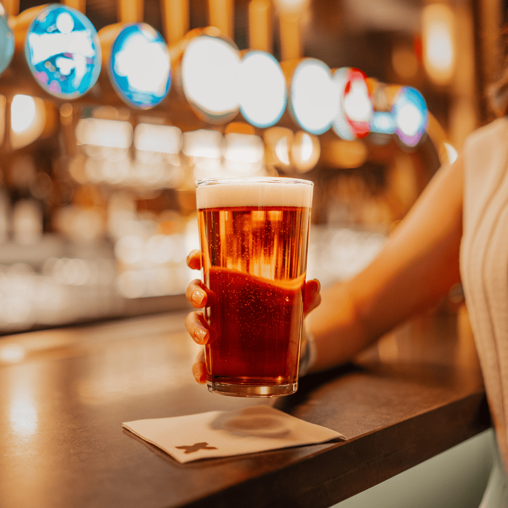 A guest enjoying a pint at Boxhall in Liverpool Street