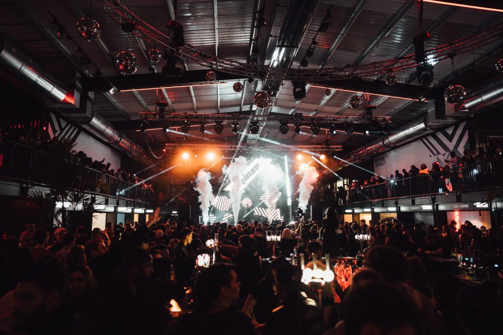 Guests dancing at BOXPARK during an event