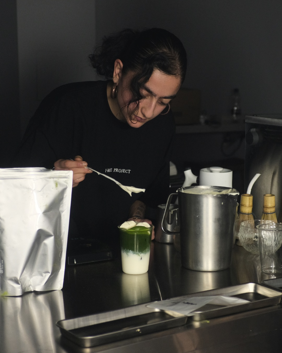 A barista making drinks at Jujuhome Cha in Boxpark Shoreditch