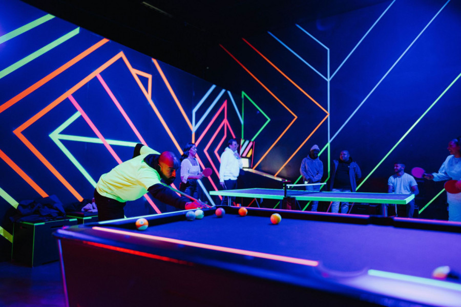 Guests playing pool in Wembley