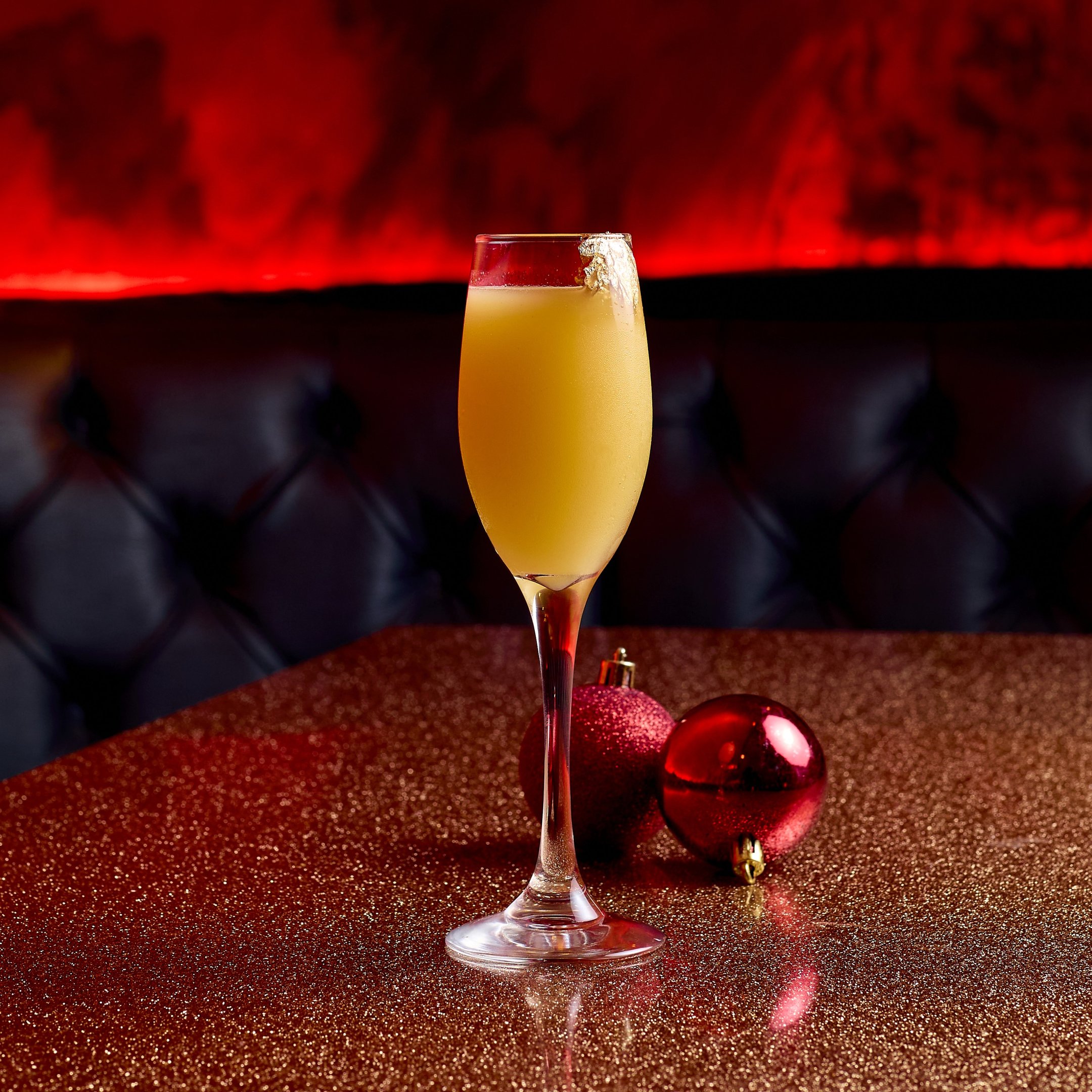 A festive Bucksfizz cocktail on a table in The Escapologist