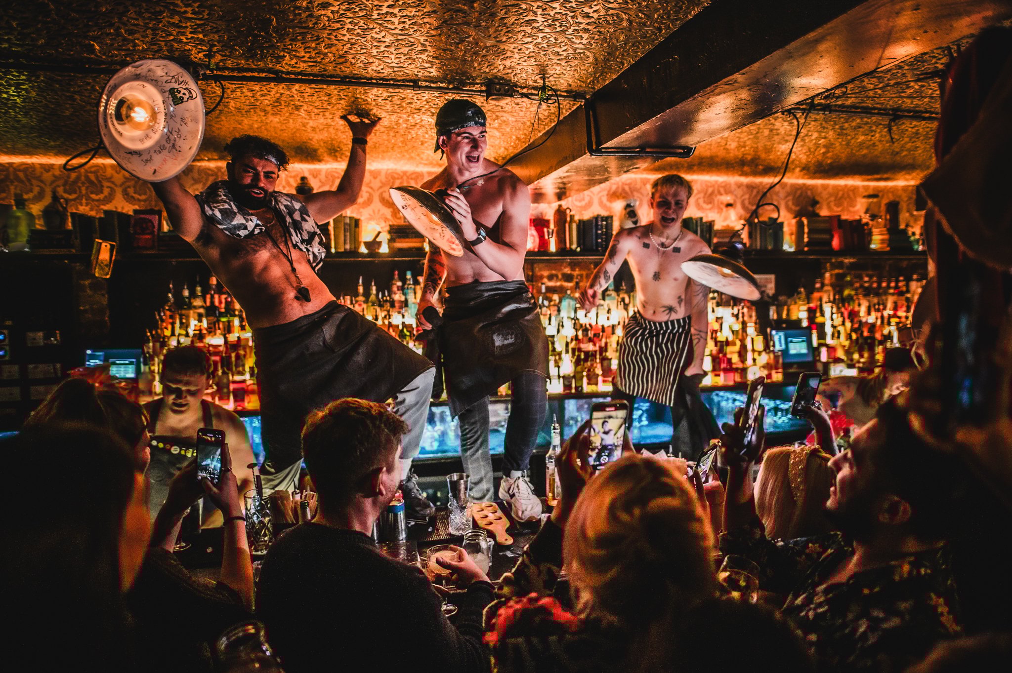 Bartenders Dancing on the bar at The Cocktail Club