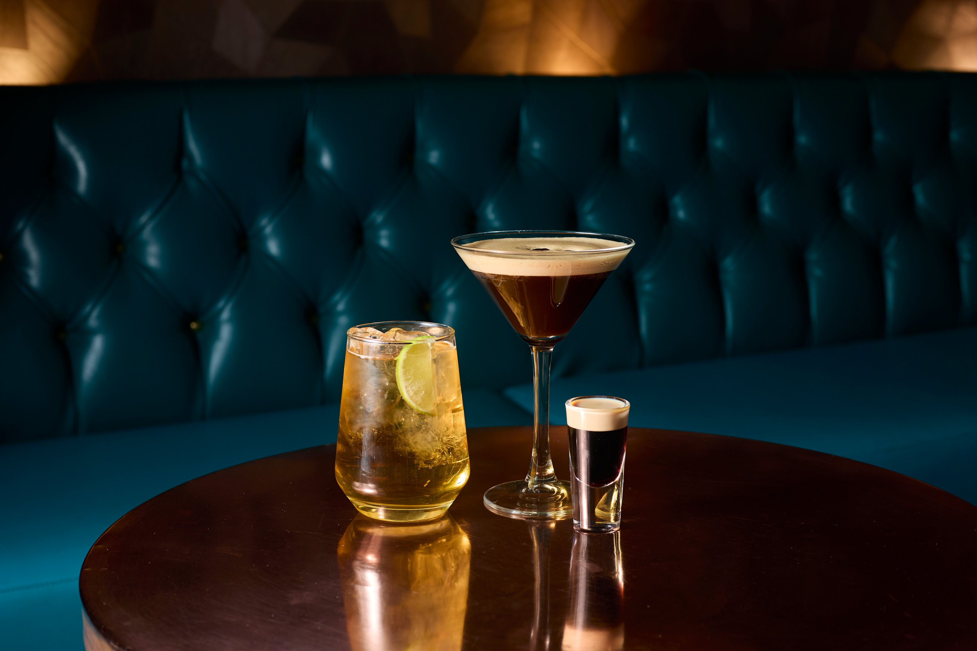 An image of three St. Patrick's Day drinks on a table in Dirty Martini