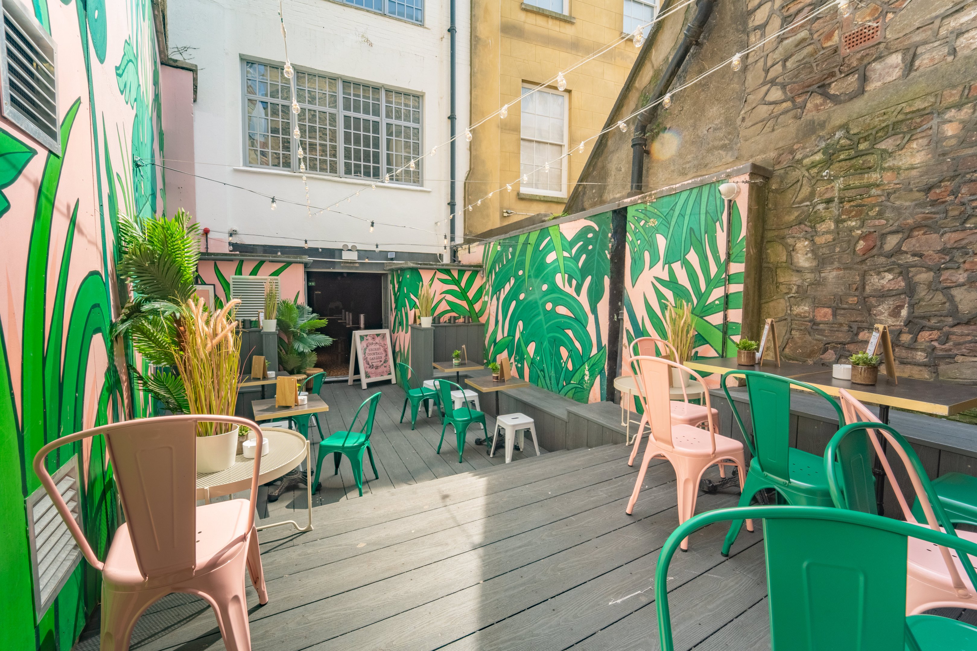 The Summer outdoor terrace at The Cocktail Club with tables and chairs
