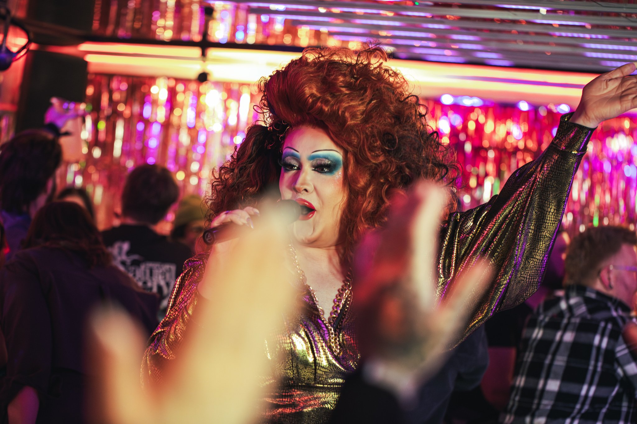 A drag queen singing at a bottomless brunch in Tonight Josephine
