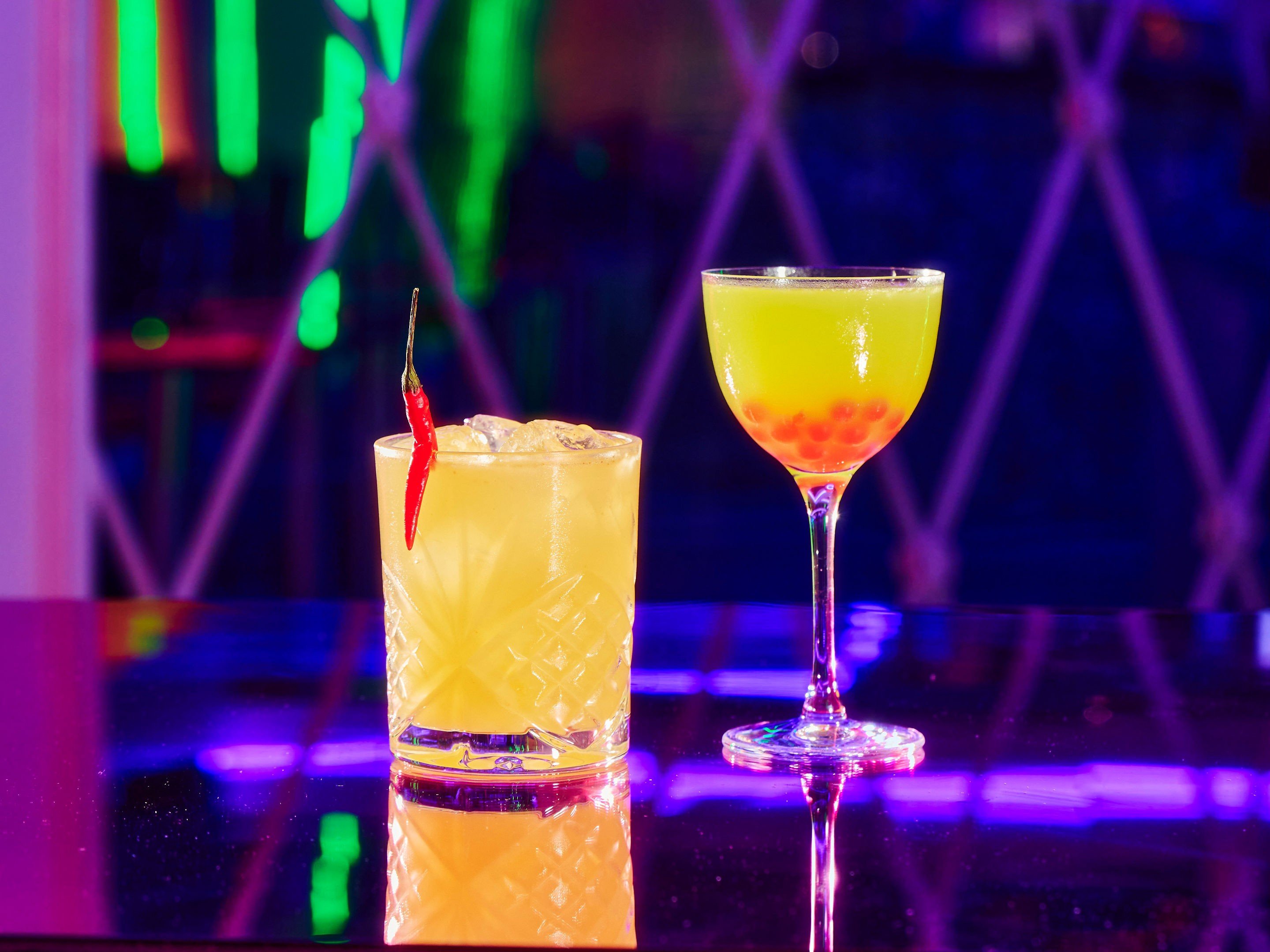 Two cocktails on a table in Tonight Josephine