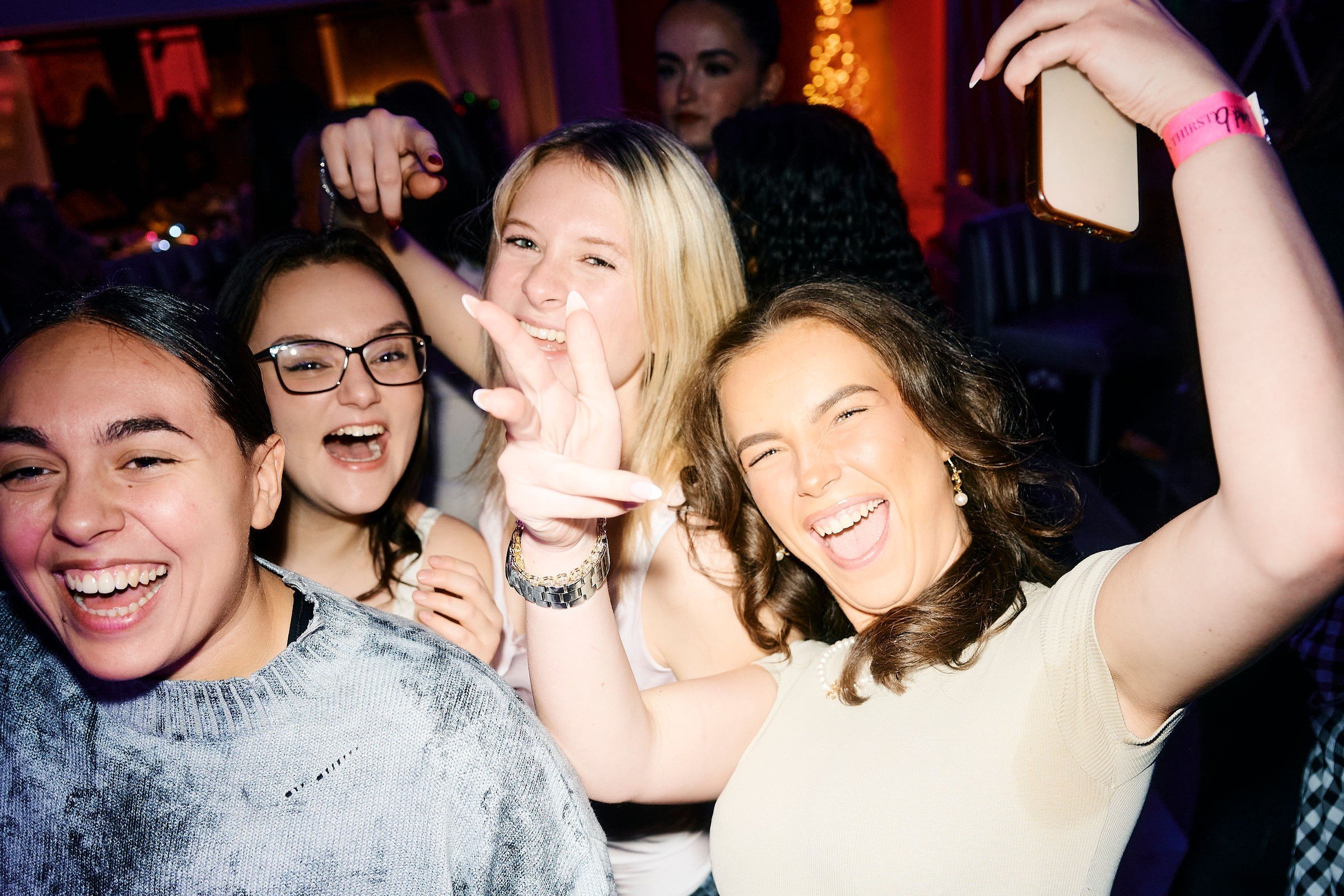 Guests posing for the camera on the dancefloor in Tonight Josephine