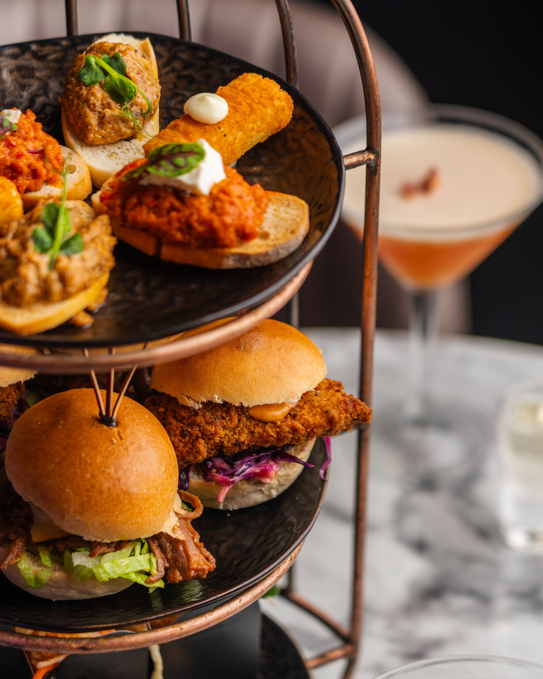 A close up image of a Dirty Martini birdcage sharer